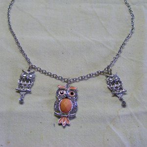 Trio of Owls handing out on a chain